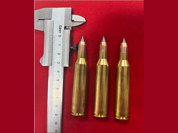 Three armour piercing cartridges measured with a caliper